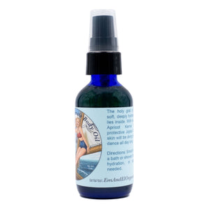 2 oz Blue glass bottle of organic body oil with jojoba oil and apricot kernel oil