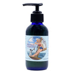 4 oz Blue glass bottle of organic body oil with jojoba oil and apricot kernel oil
